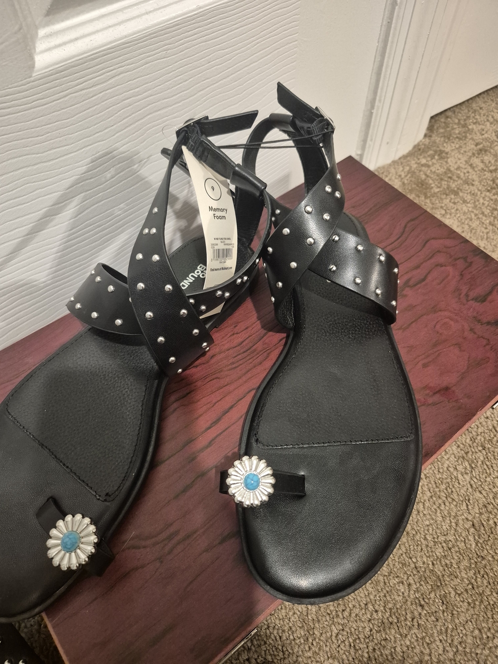 No Boundaries Black Studded Ankle-Strap Sandals with Blue Daisy Accent